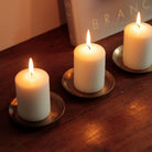 small round brass plate for candles.