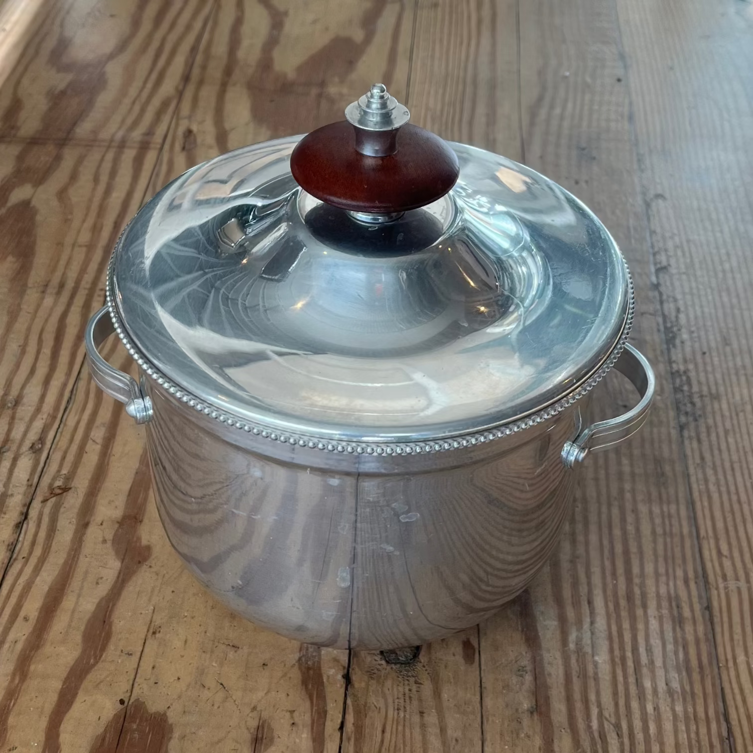silver pyrex ice bucket with wooden  detail.