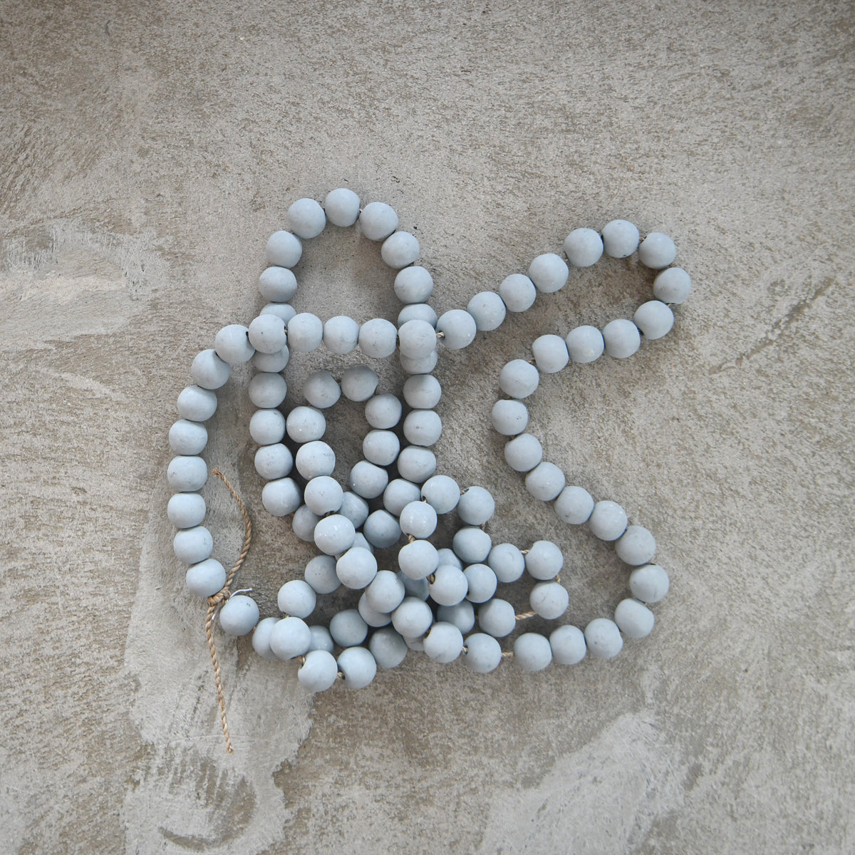 wooden gray bead string.