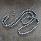 matte gray wooden decor bead strand.