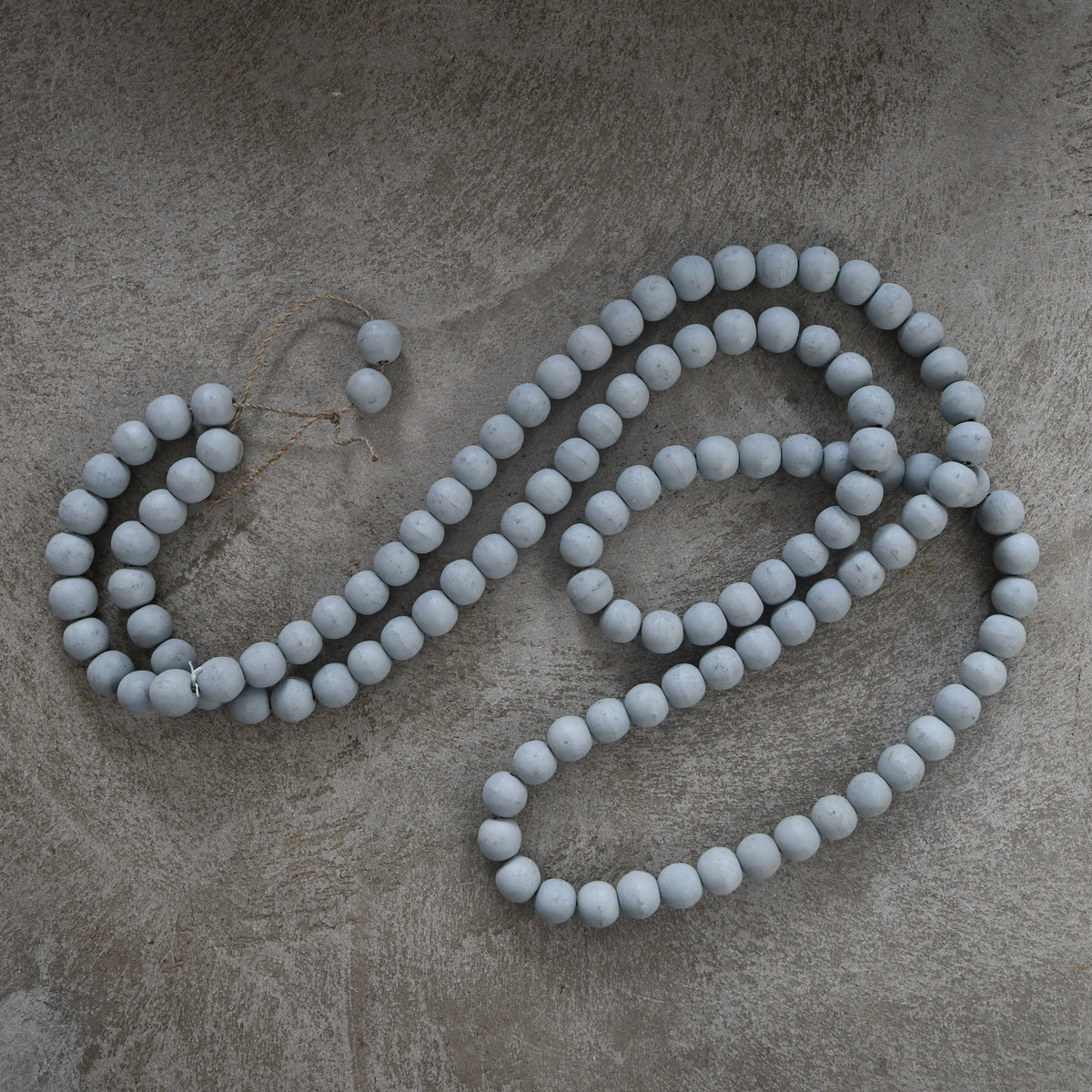 matte gray wooden decor bead strand.