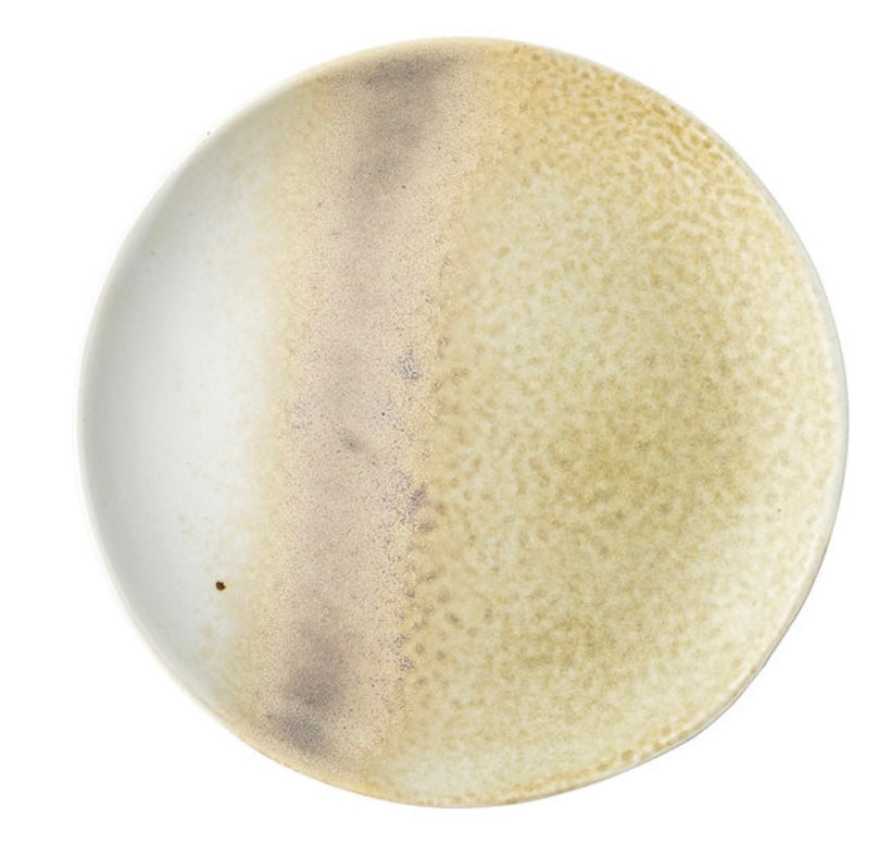 A Stoneware Plate, Plum by Bloomingville with an off-white glaze and subtle brown speckles on a white background.