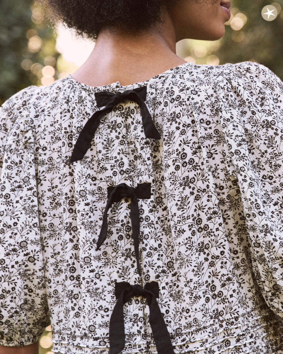 The Great Songbird Dress in Black and White Floral Print with Bows - Shoppe Details and Design.